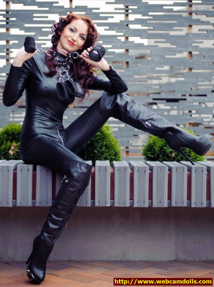 Redhead Girl in Black Kneehigh Boots and Black Leather Suit on Webcamdolls